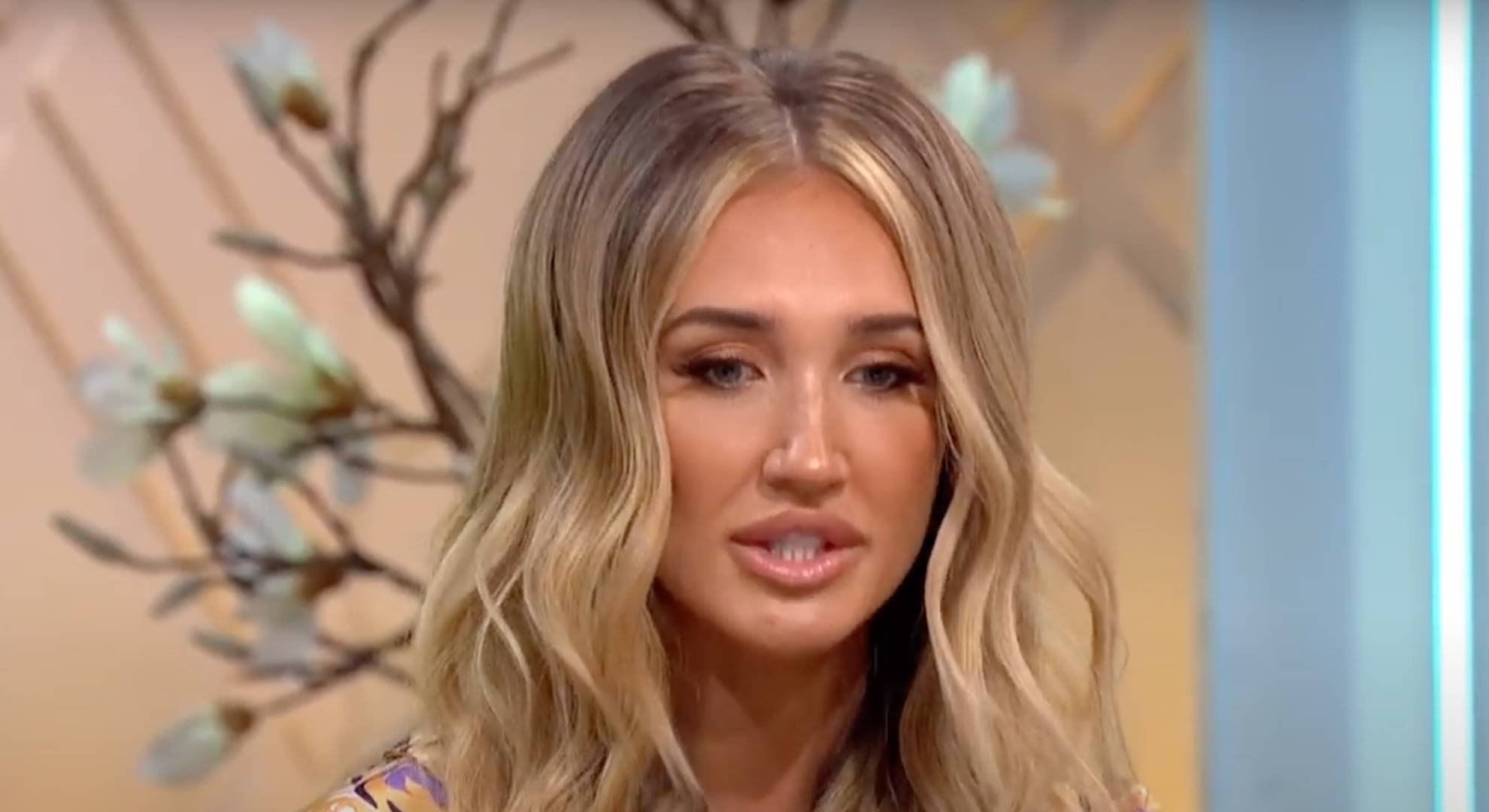 Megan McKenna looks downwards