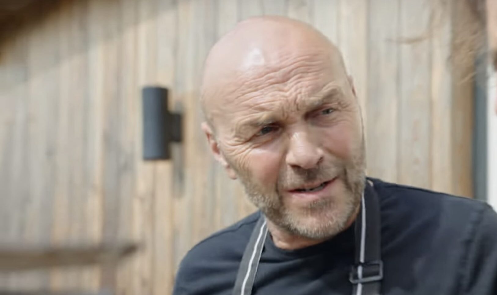 Simon Rimmer outside wearing a chef's apron