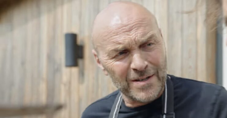 Simon Rimmer outside wearing a chef's apron