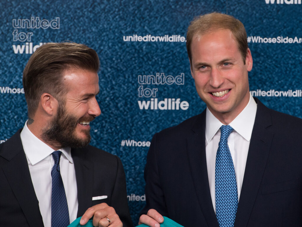 David Beckham and Prince William smiling