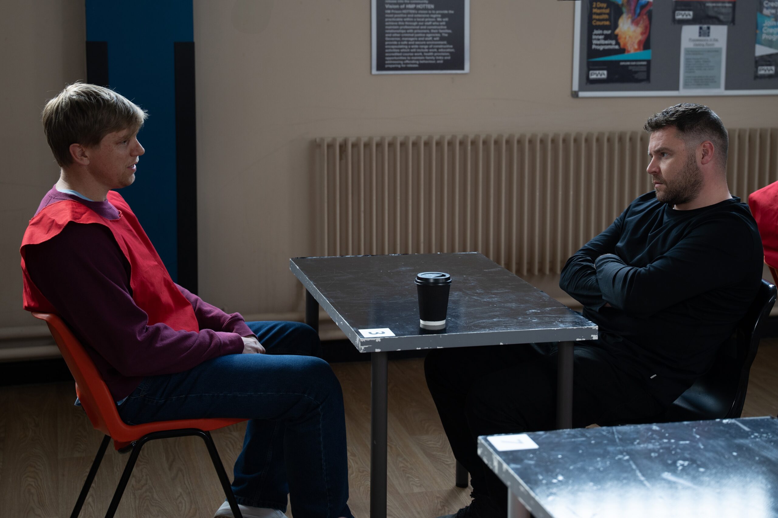 Robert and Aaron talking at the prison