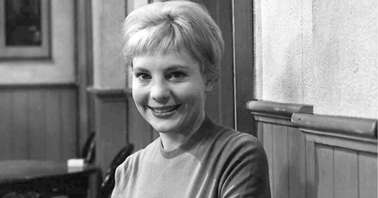 Barbara Lewis smiling in a black and white picture from Coronation Street (Credit: Shutterstock/ITV/Composite: ED!)