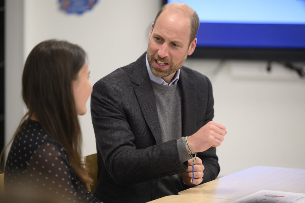 Prince William talking to a woman at royal engagement