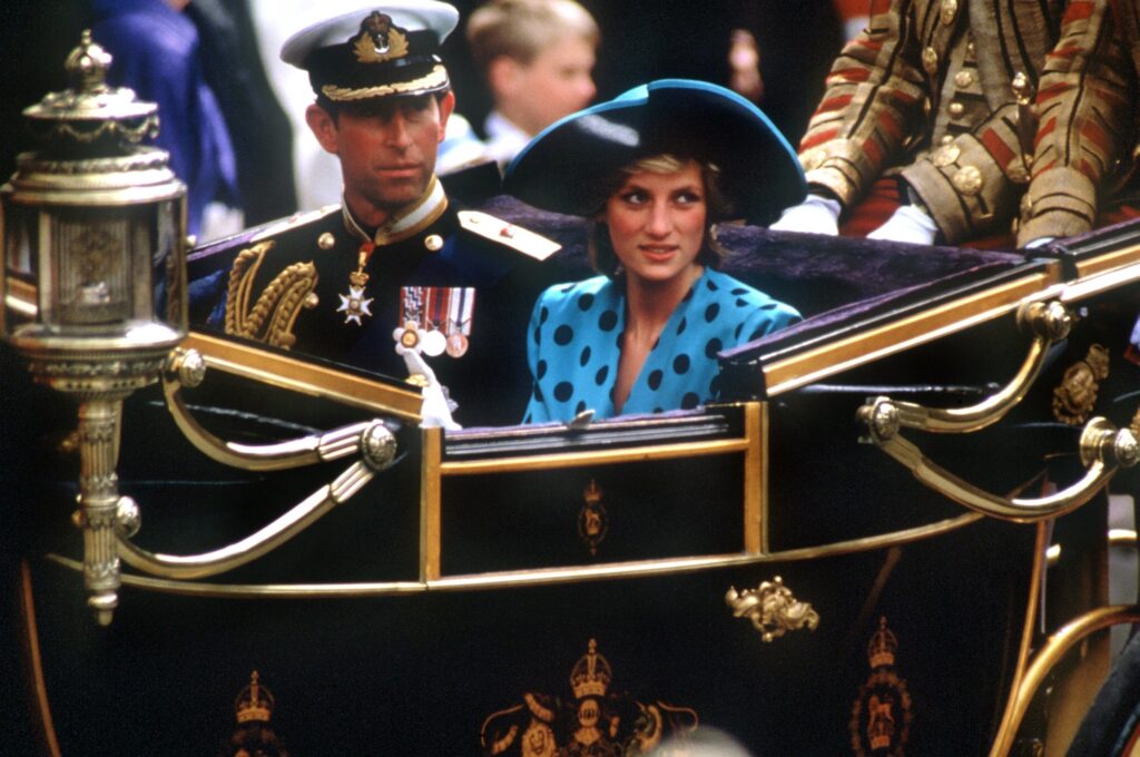 Prince Charles and Princess Dian ride in a carriage