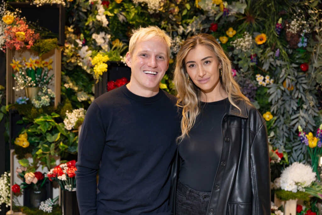 Jamie Laing and wife Sophie Habboo smiling at event