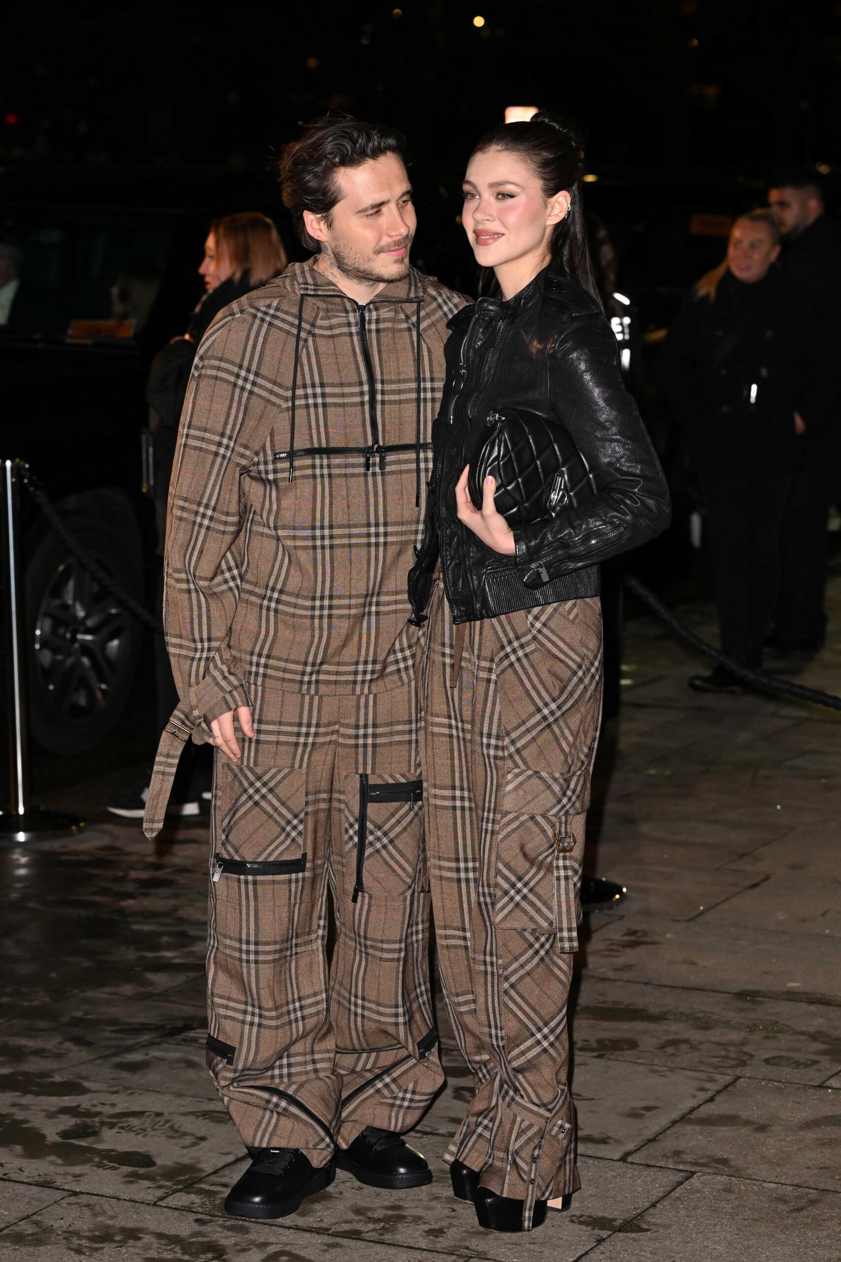 Brooklyn Beckham looking at Nicola Peltz 