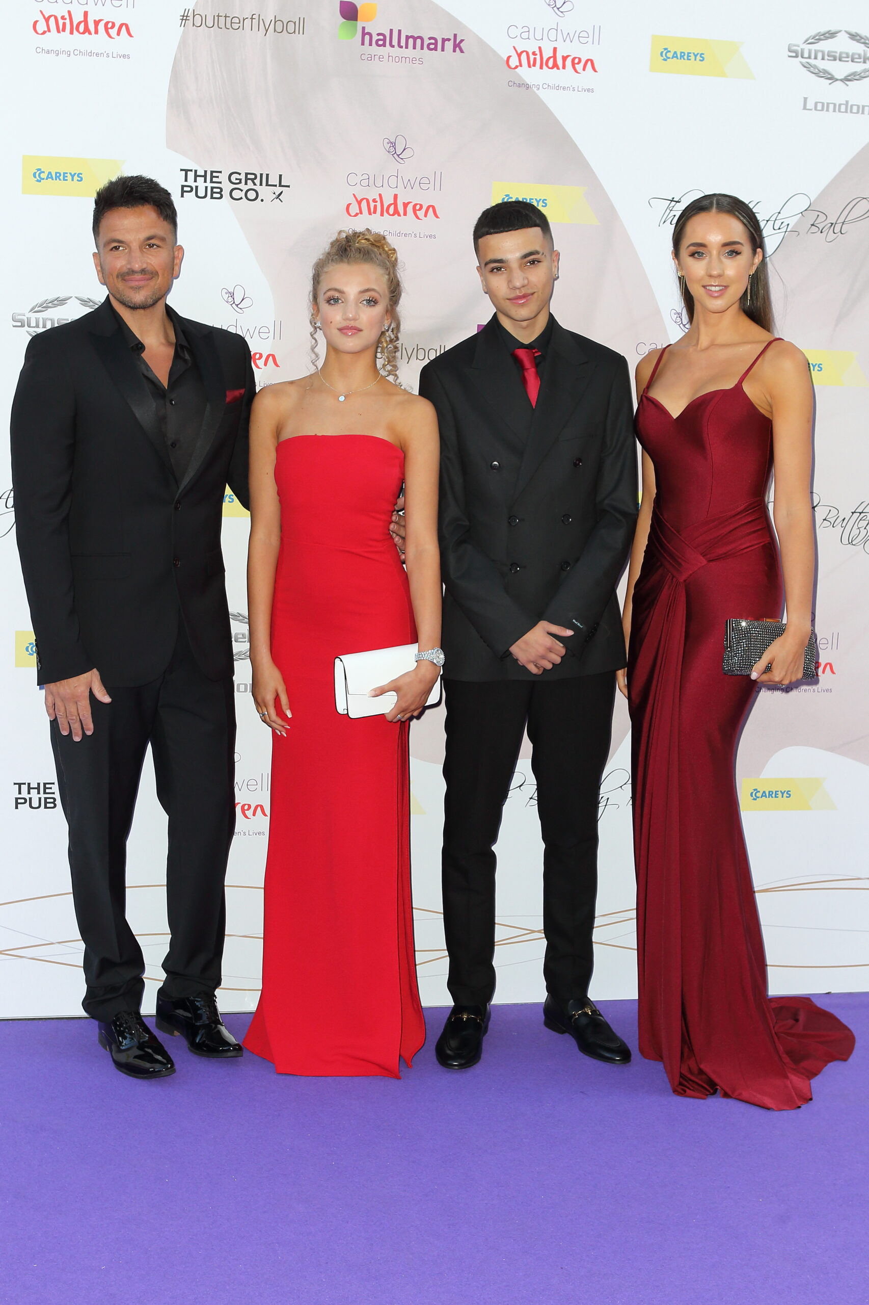 Peter, Princess, and Junior Andre and Emily MacDonagh on the red carpet