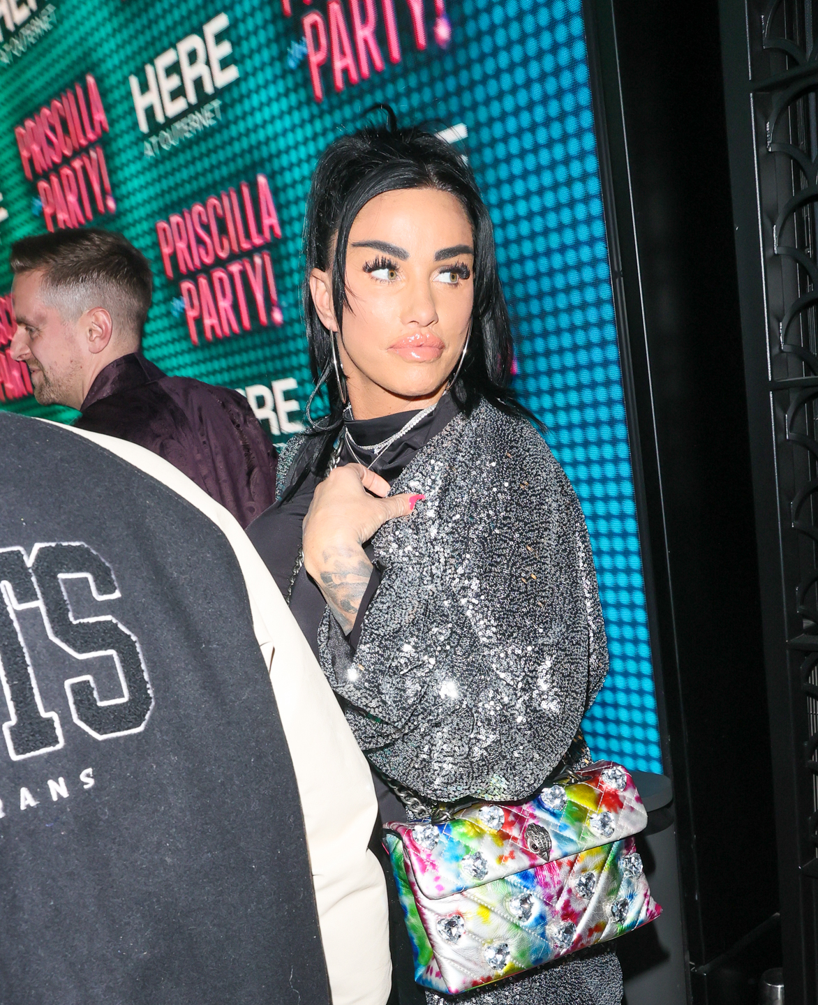 Katie Price looking over her shoulder
