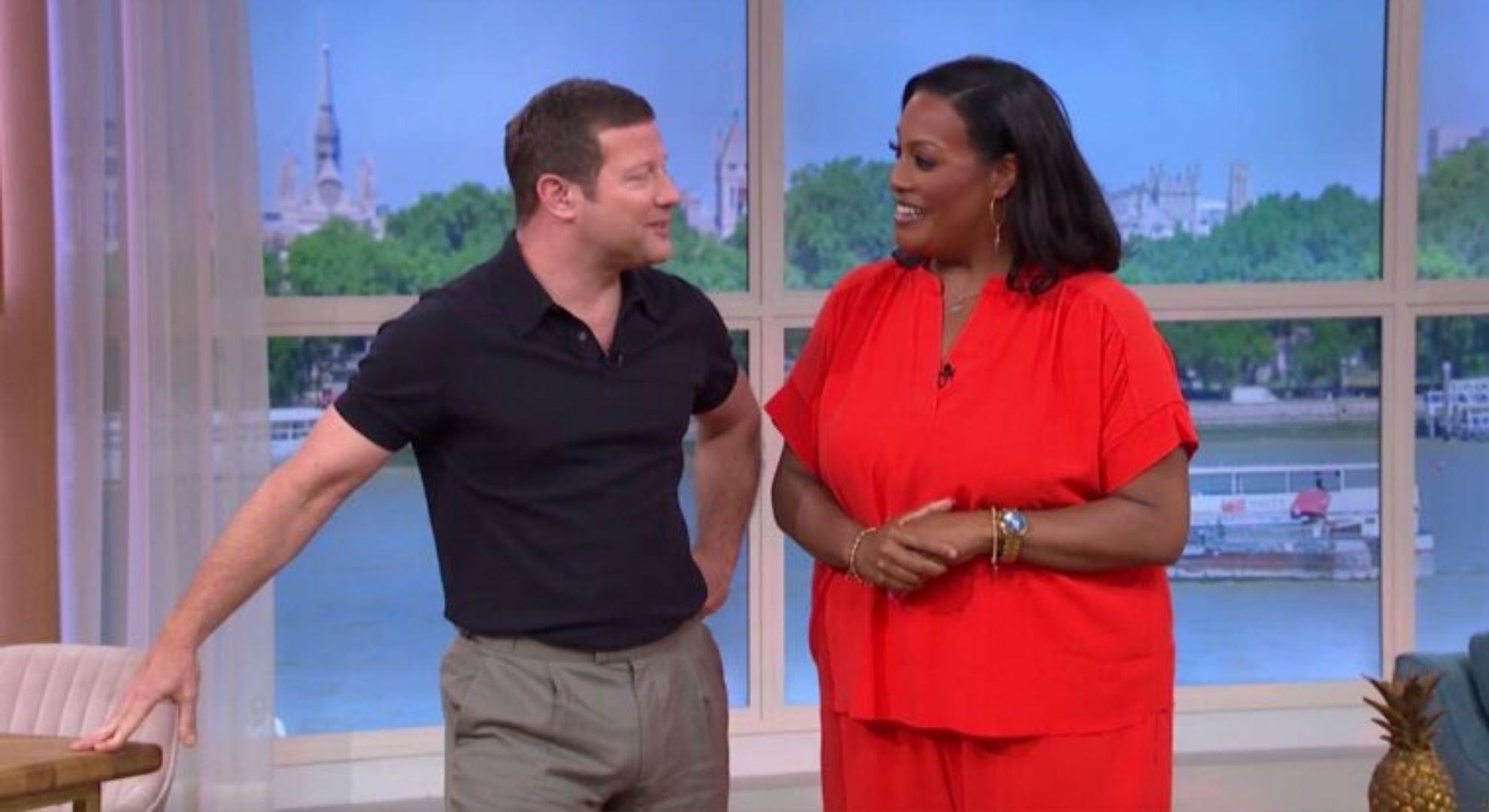Dermot O'Leary and Alison Hammond smiling at each other