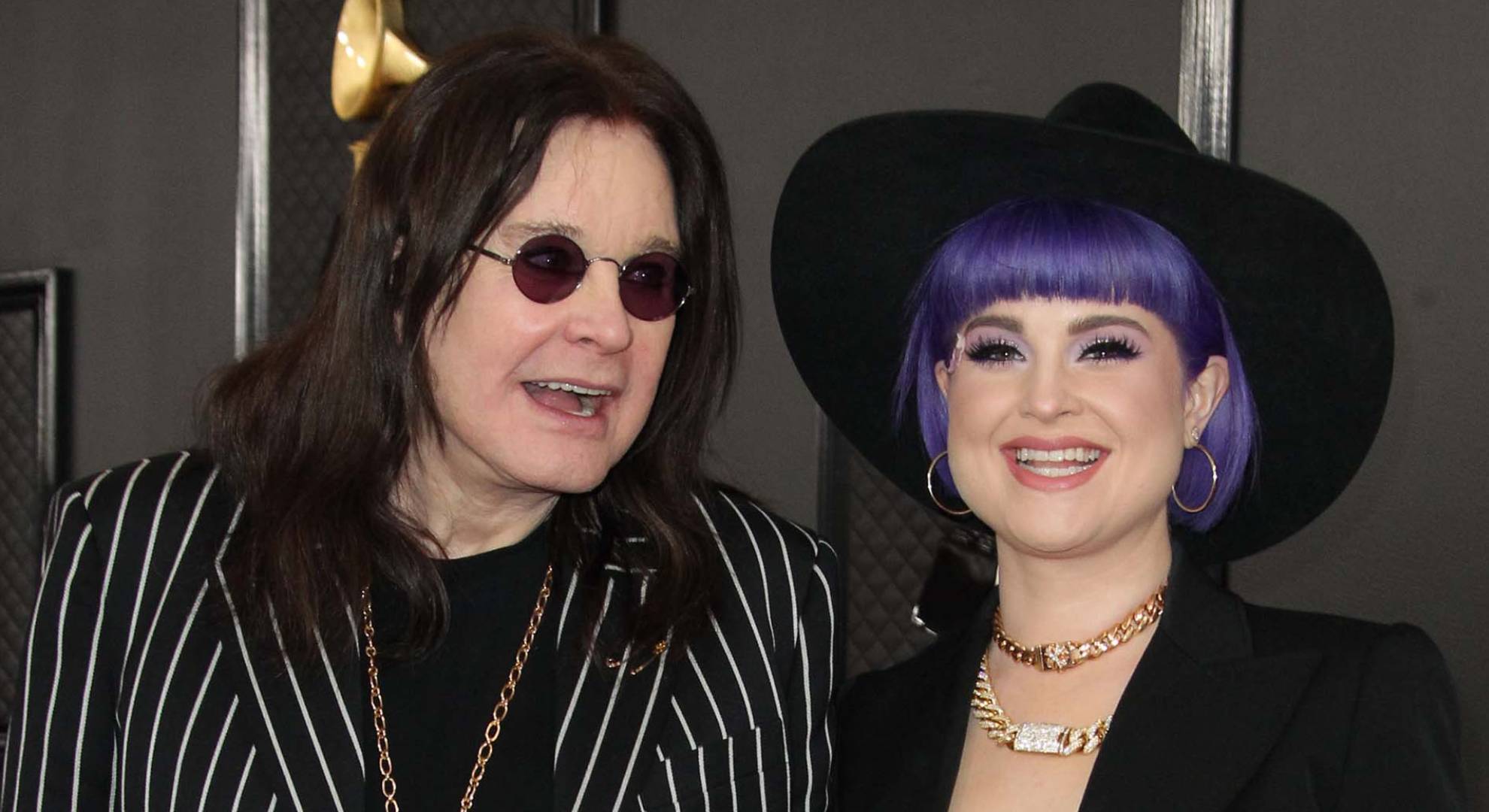 Kelly Osbourne and Ozzy Osbourne smiling together