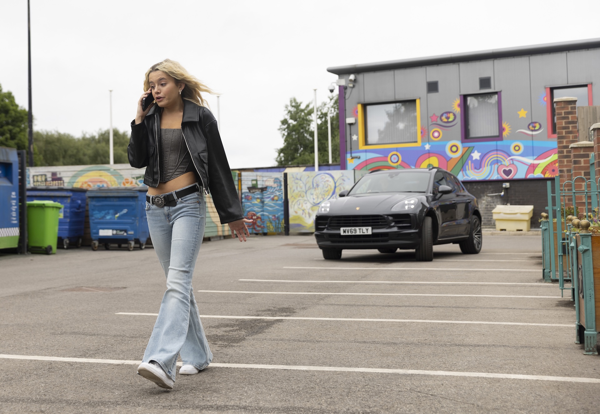 Coronation Street's Betsy on phone in front of car