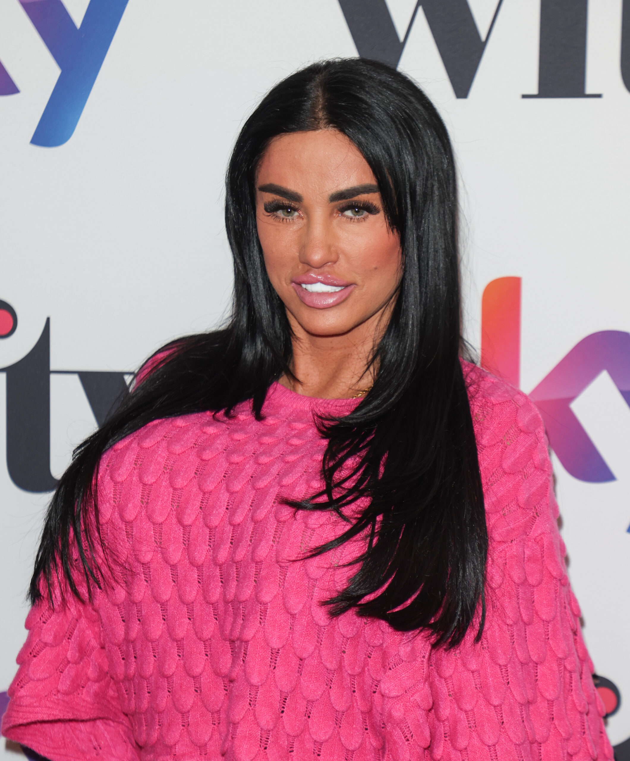 Katie Price in a pink jumper