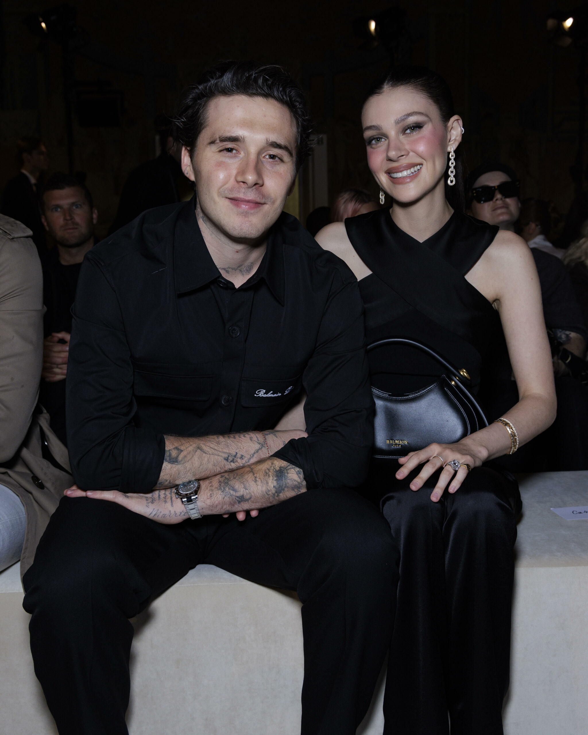 Brooklyn Beckham and Nicola Peltz posing and smiling.