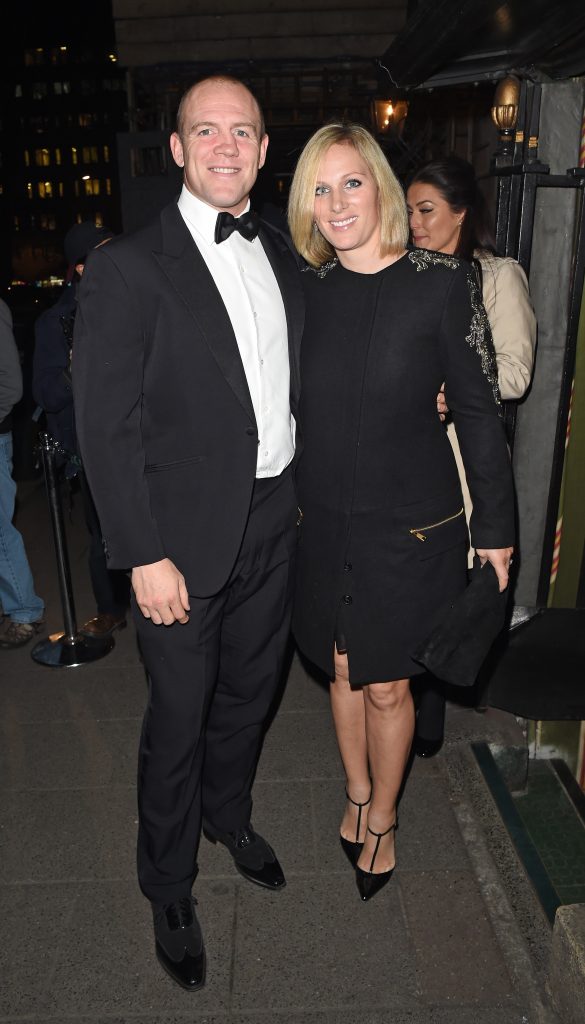 Zara and Mike Tindall stand next to each other and smile