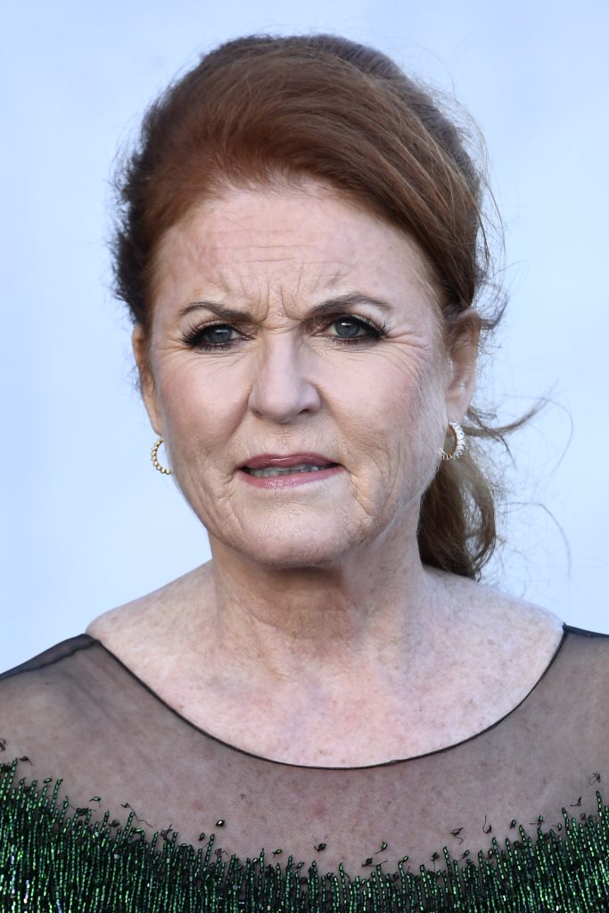 Sarah Ferguson frowning in green dress at event