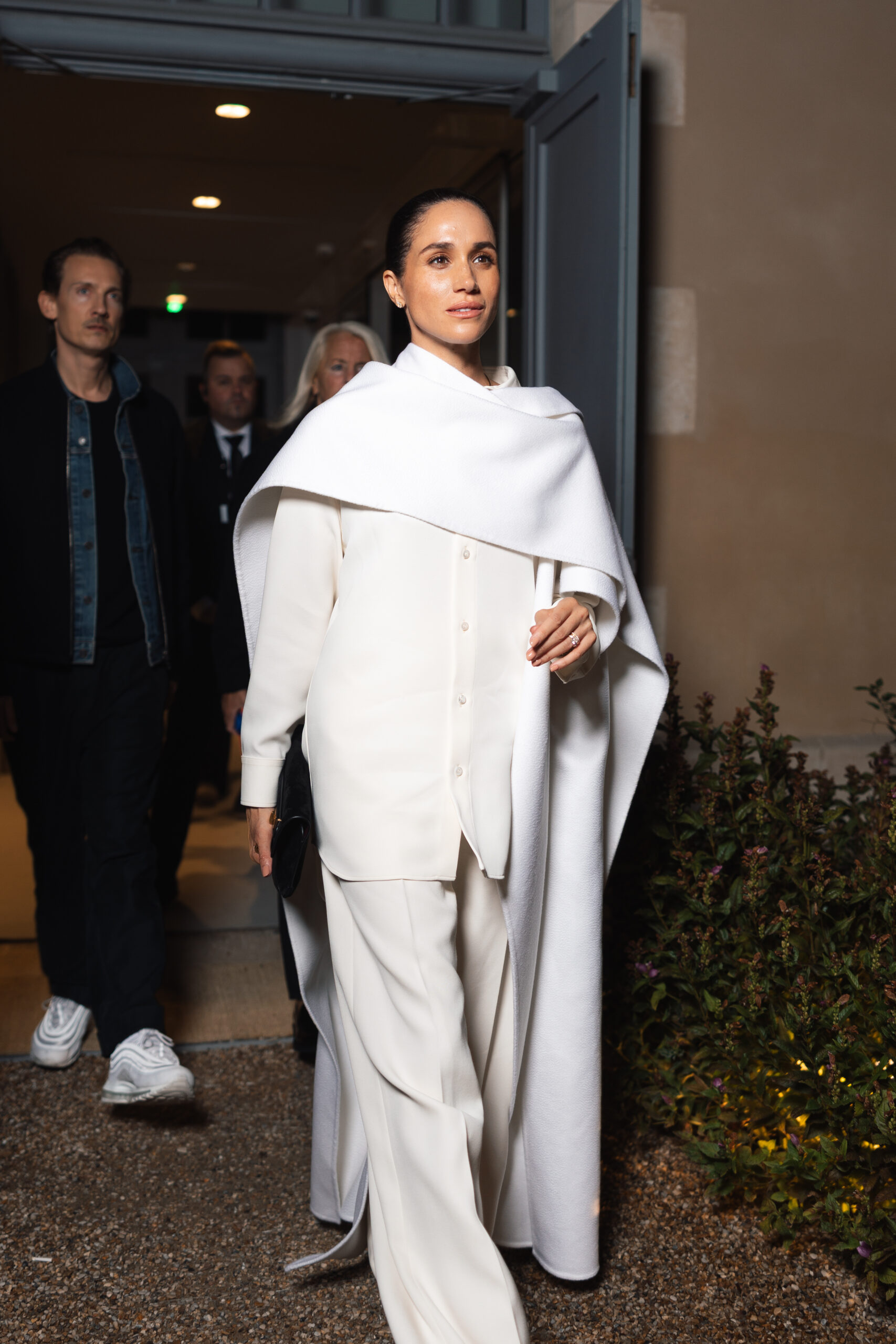 Meghan Markle wearing an all white outfit at Paris Fashion Week