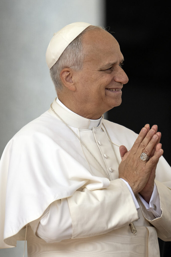 Pope Leo clasping his hands together 