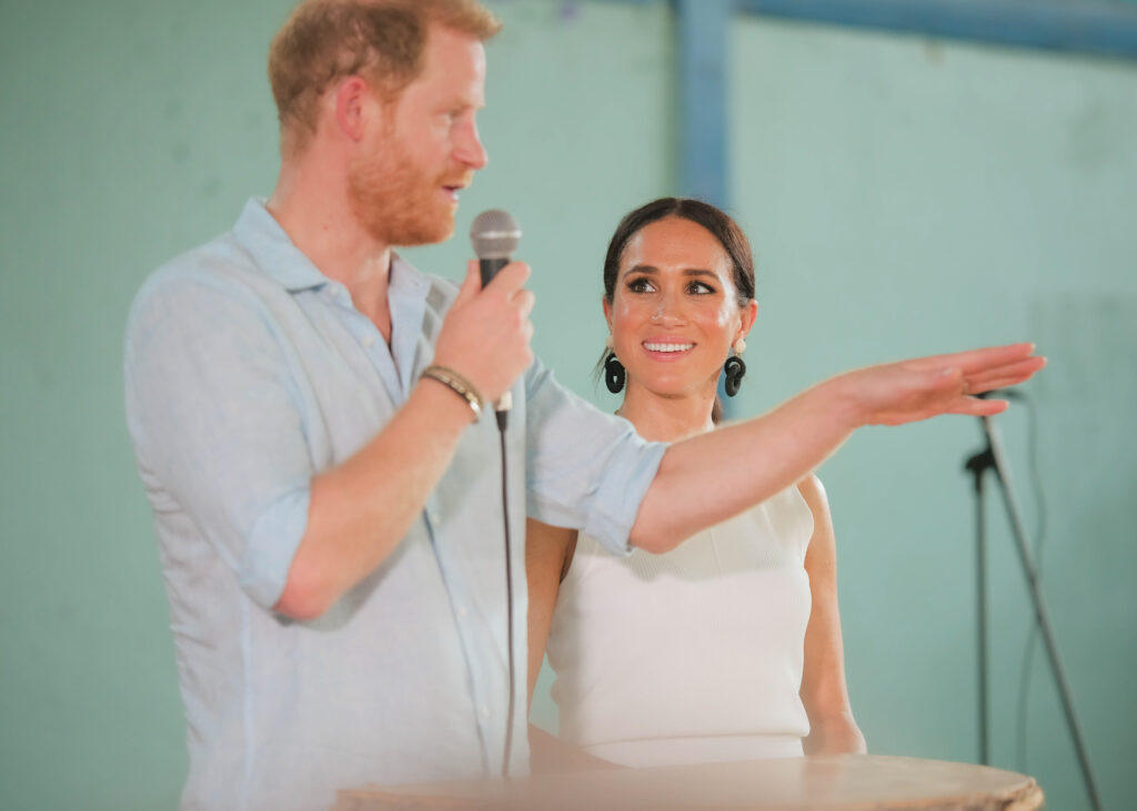 Prince Harry and Meghan Markle speaking at event