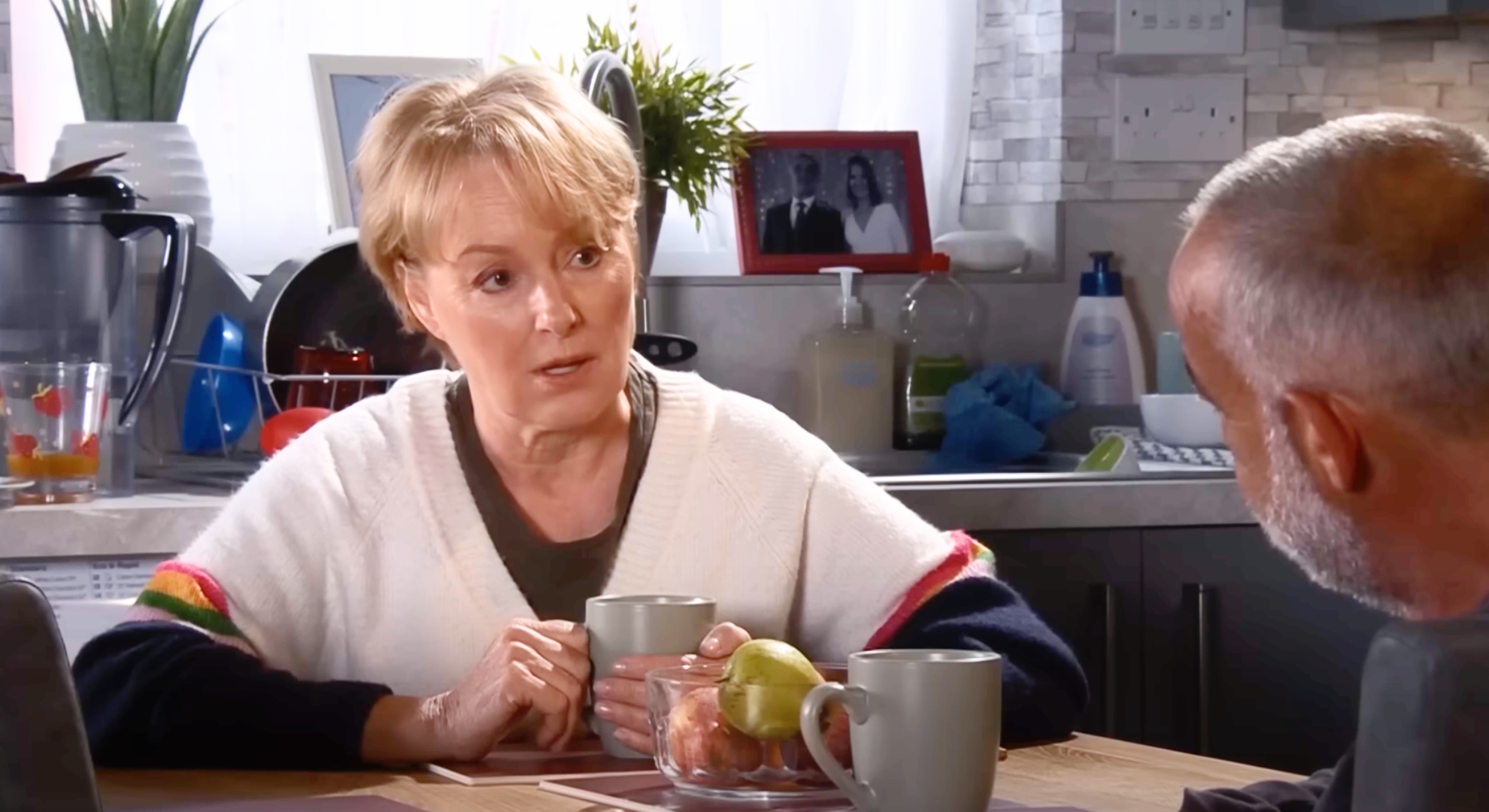 Coronation Street's Sally talking to Kevin at the table