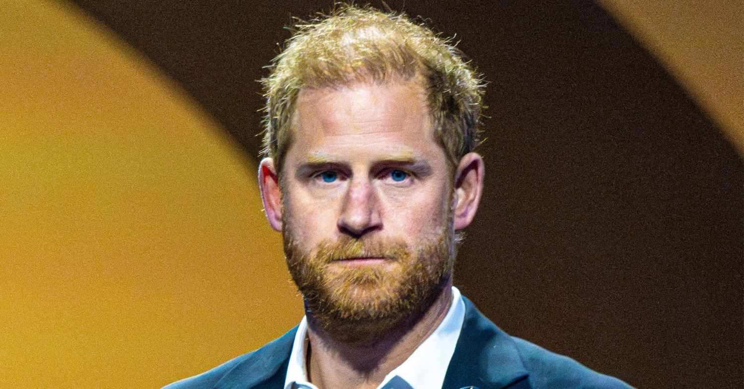 Prince Harry looks serious during speech