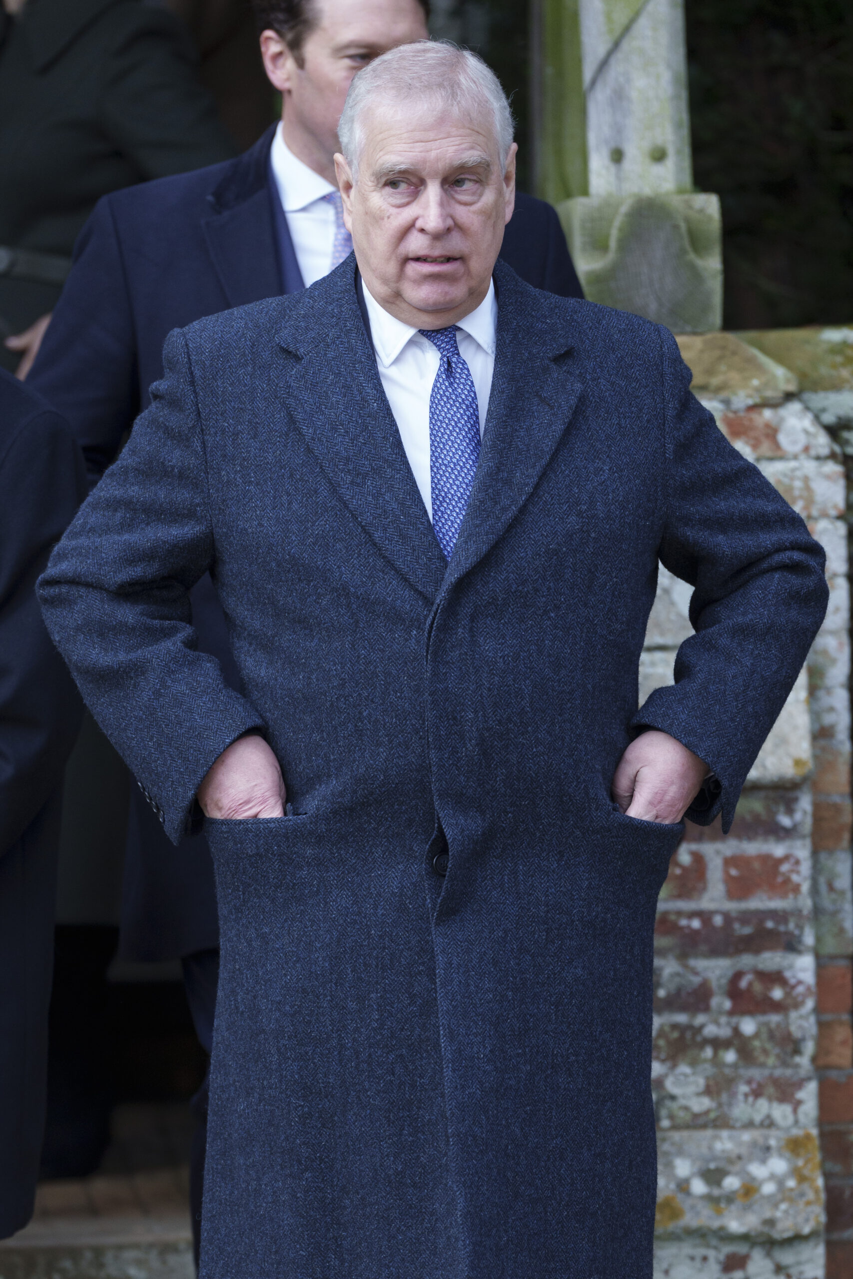 Prince Andrew walking in black coat