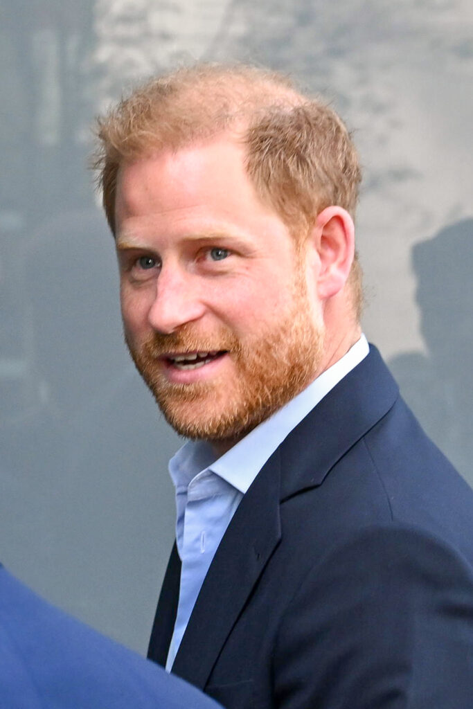 Prince Harry smiling in the UK