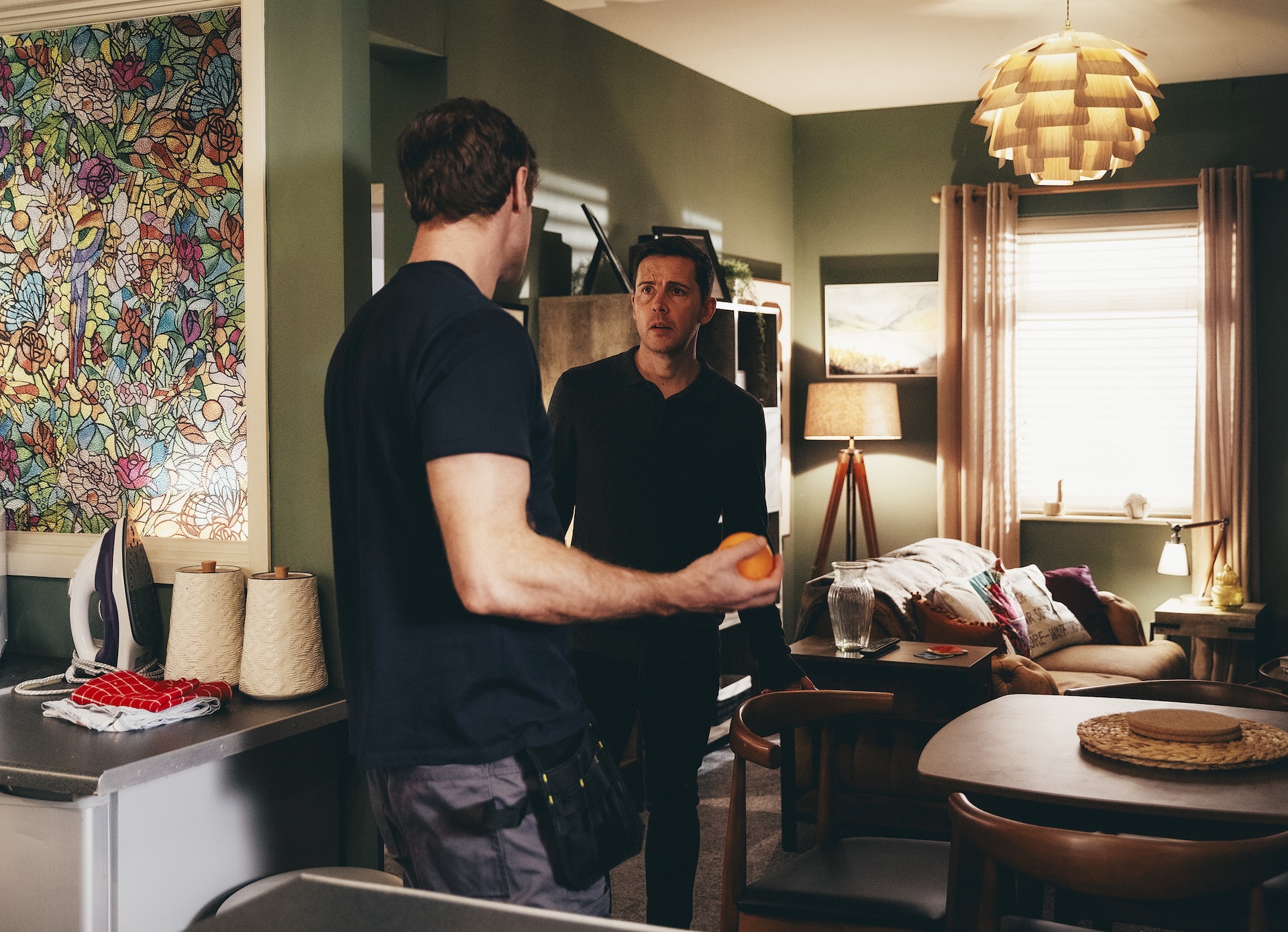 Todd and Theo serious in flat