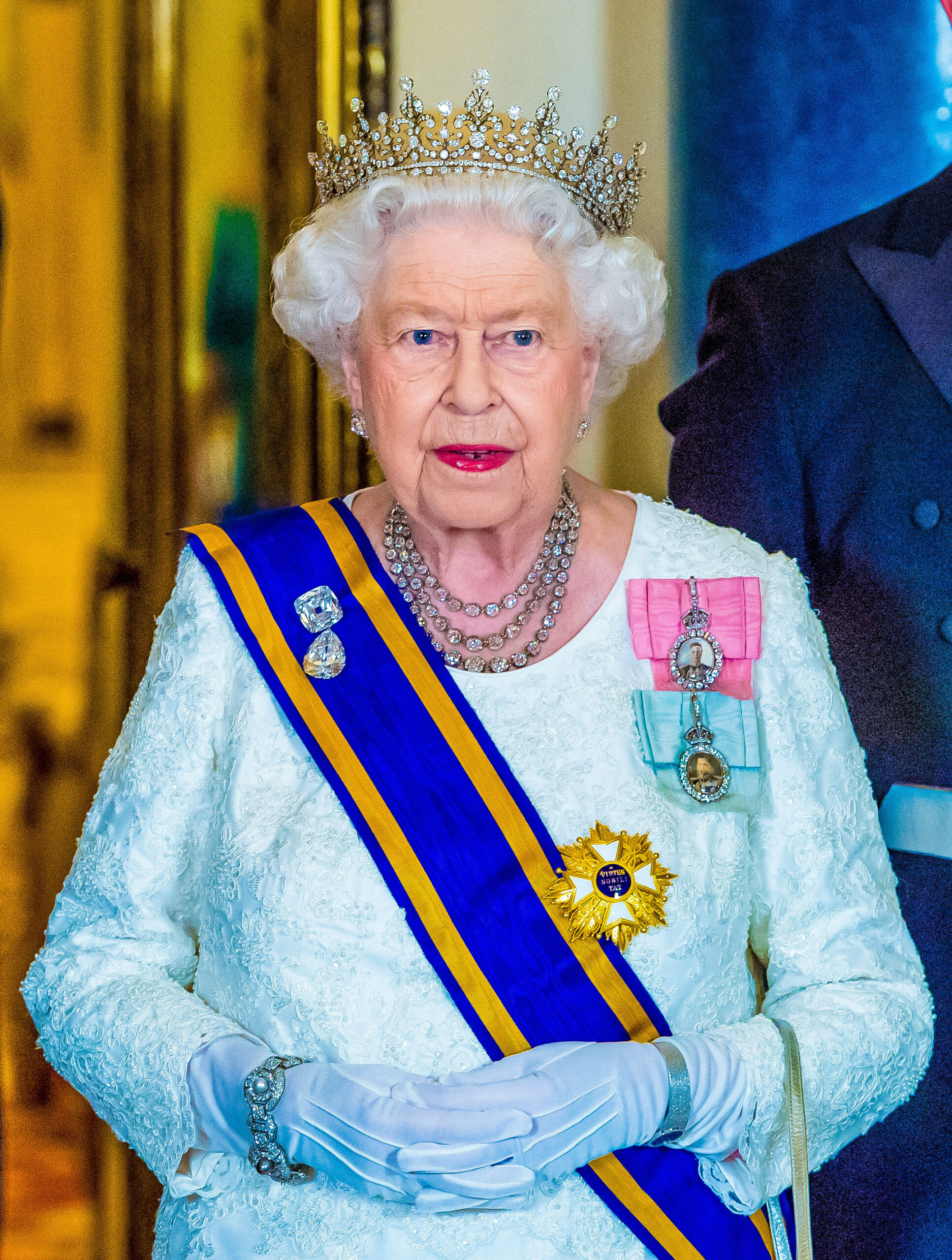 Queen Elizabeth wearing a crown at royal event