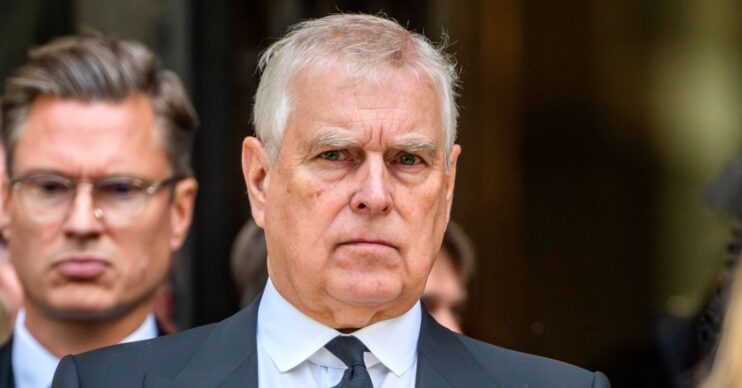 Andrew Mountbatten-Windsor in black suit looking at camera