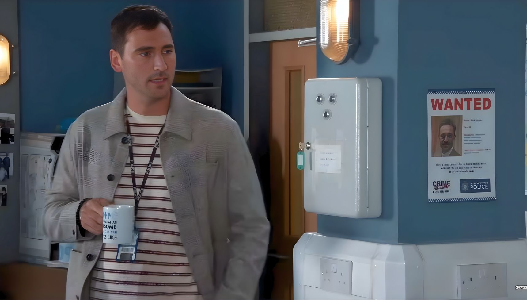 Kit drunk tea next to John's wanted poster and it sparked huge theories (Credit: ITV)