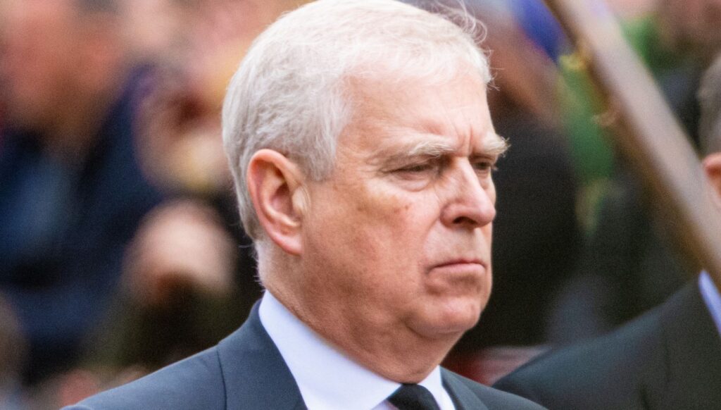 Andrew Mountbatten-Windsor in a suit frowning