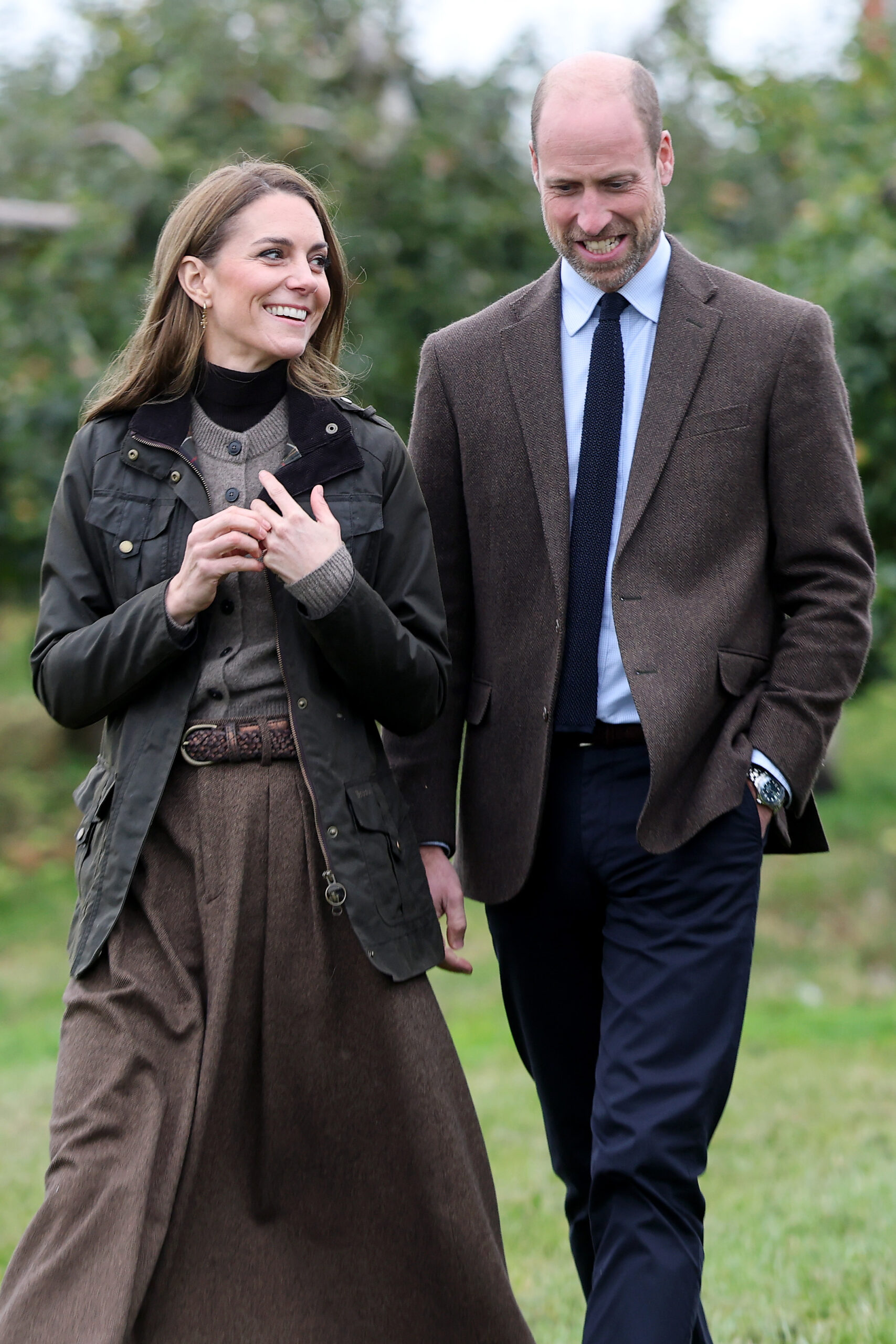Kate Middleton and Prince William smiling during royal engagement