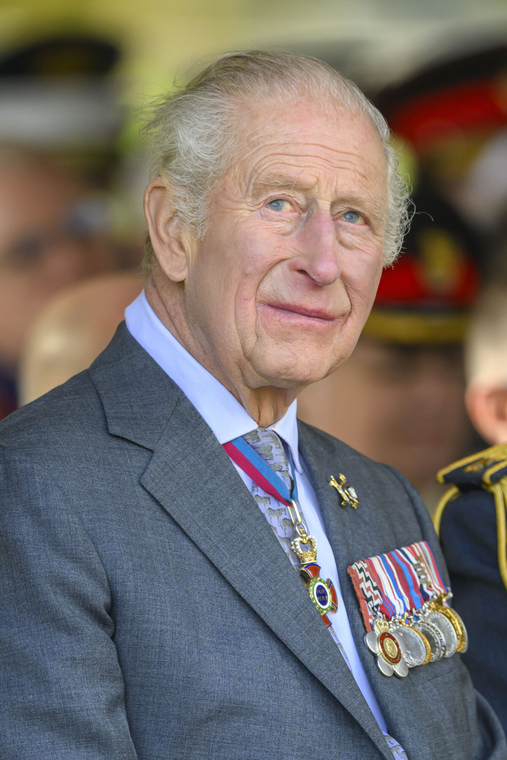 King Charles in suit at service