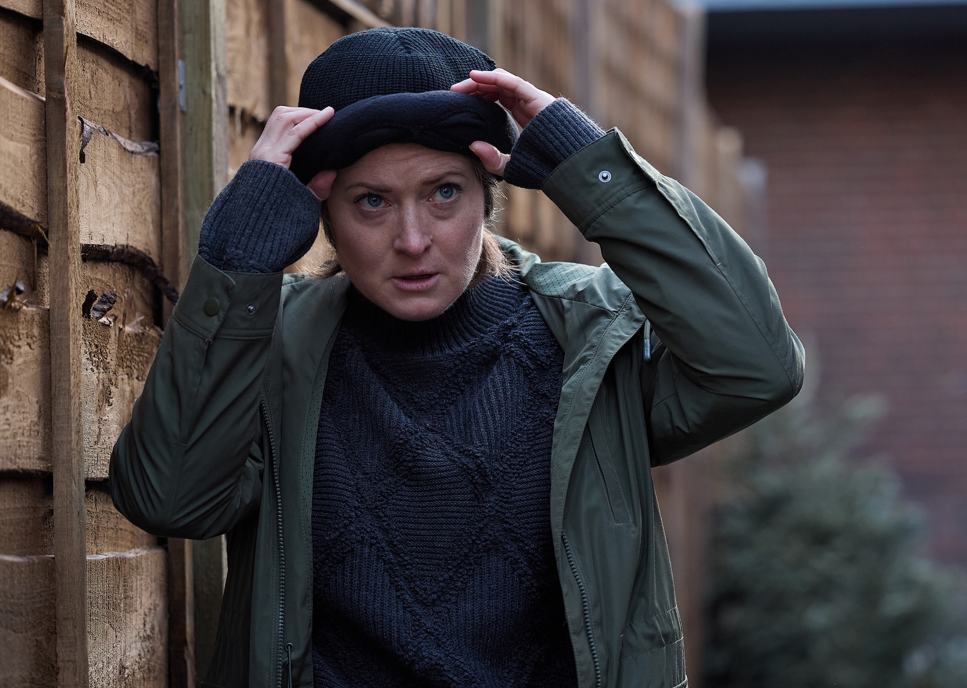 Becky putting on hat in Coronation Street