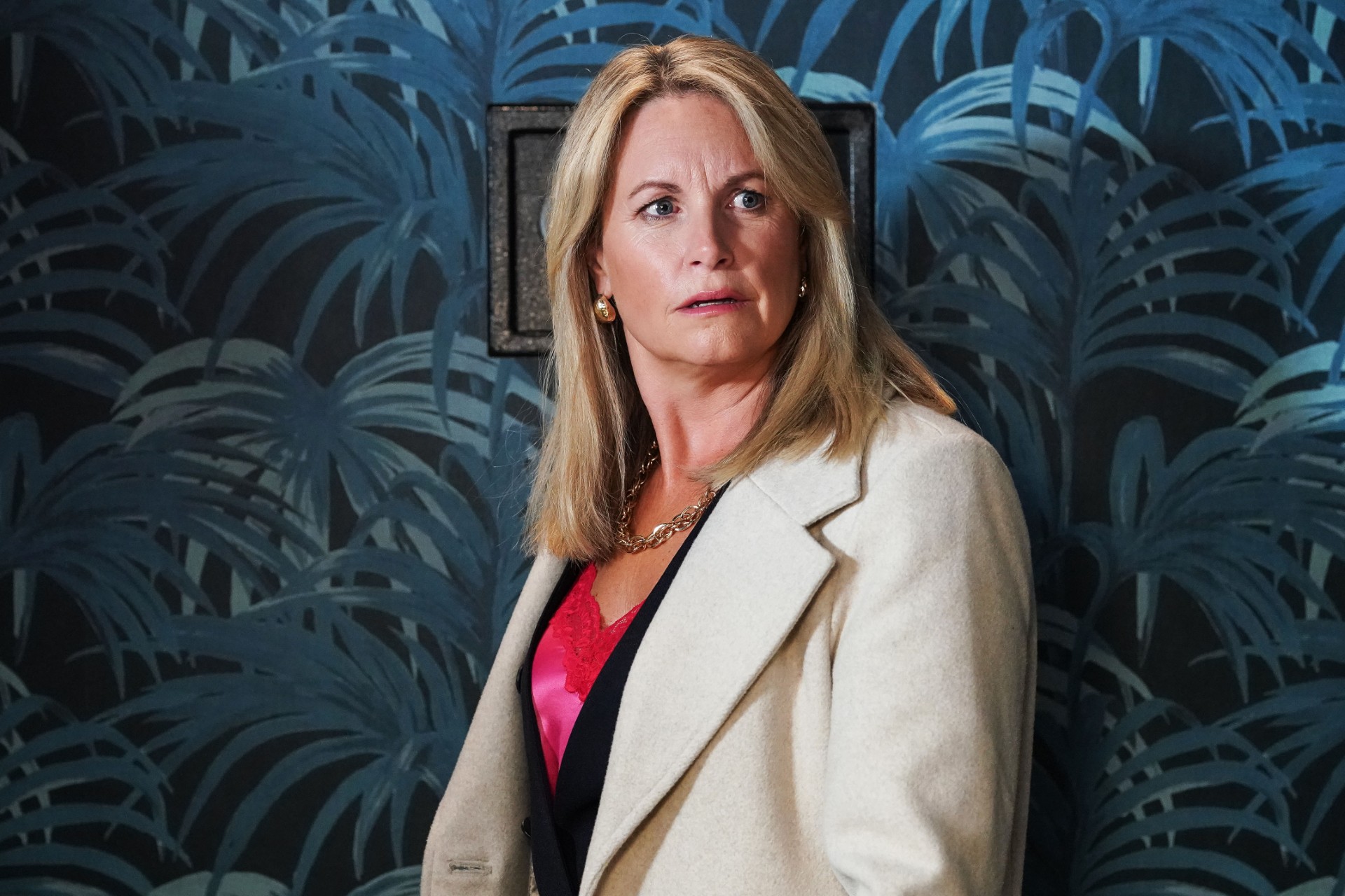 Sam looks shocked in EastEnders