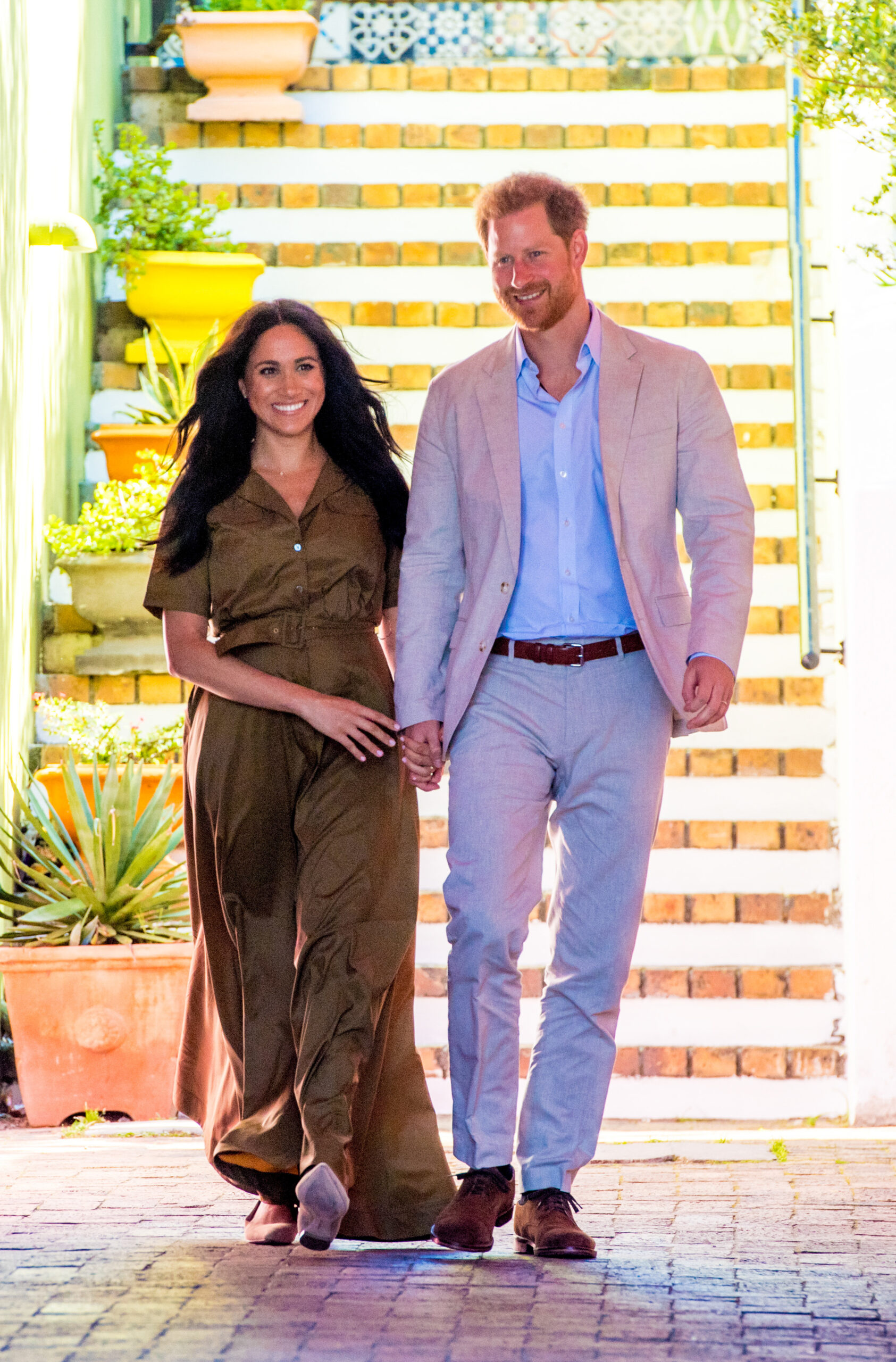 Prince Harry and Meghan Markle walking and holding hands