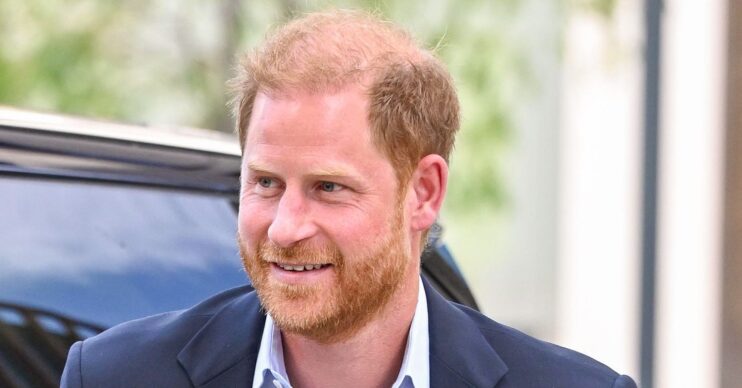 Prince Harry getting out of a car