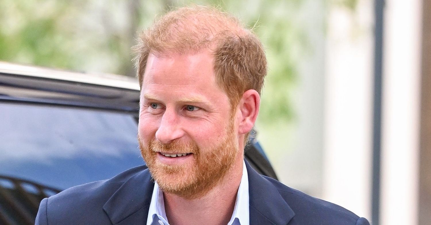 Prince Harry getting out of a car