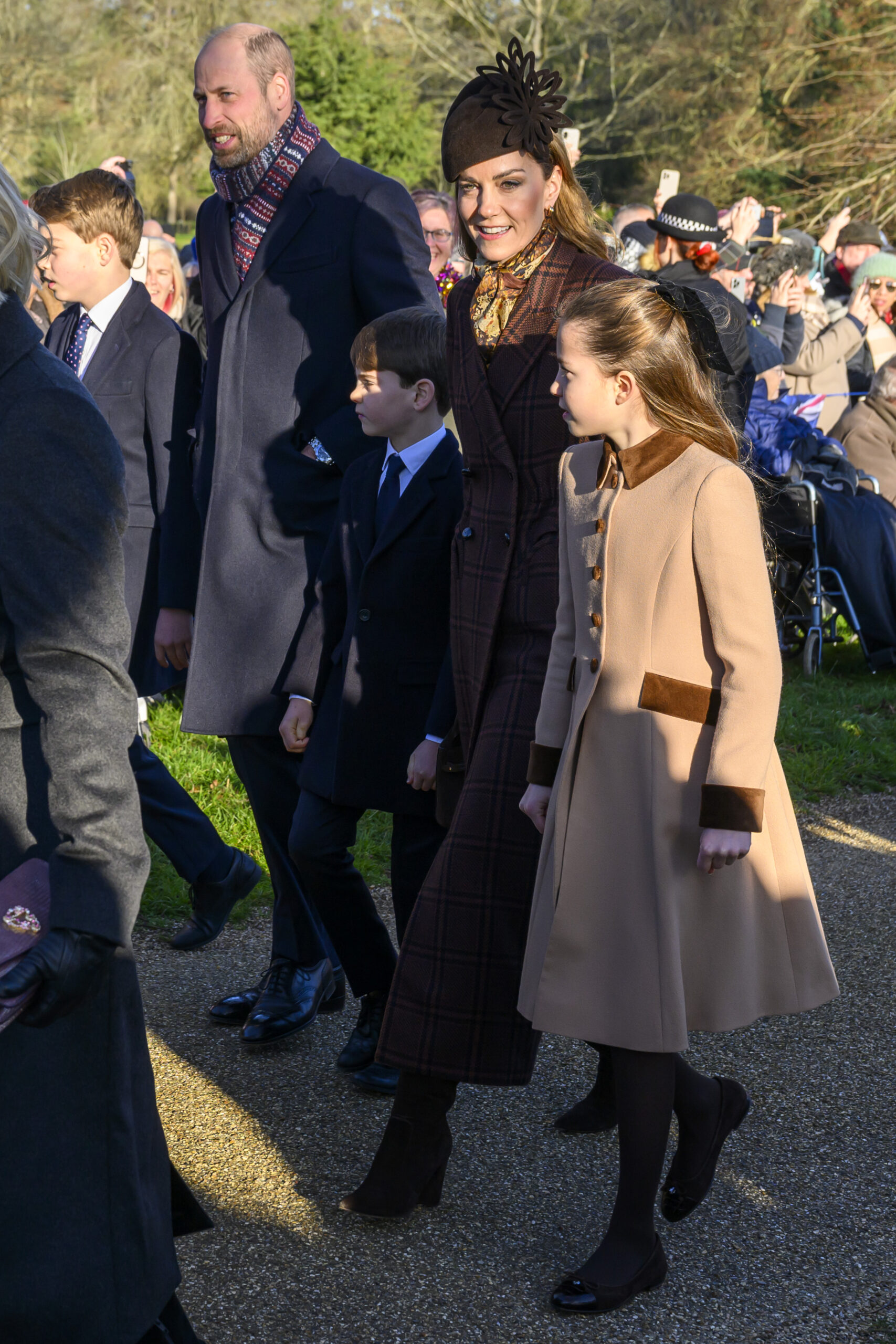 Prince George, Prince William, Prince Louis, Kate Middleton and Princess Charlotte during Christmas Day walkabout