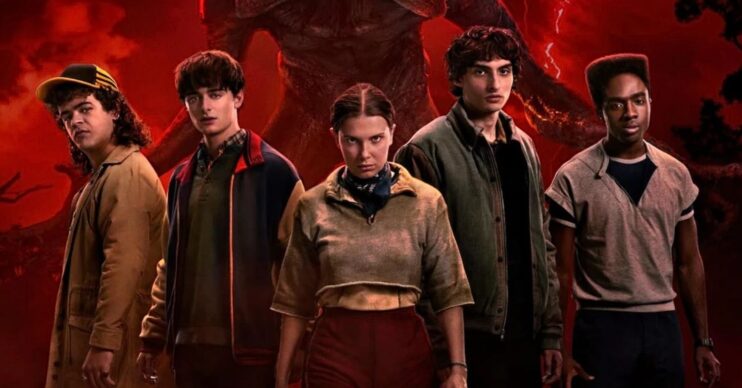 The cast of Stranger Things season 5 standing in front of a demogorgon
