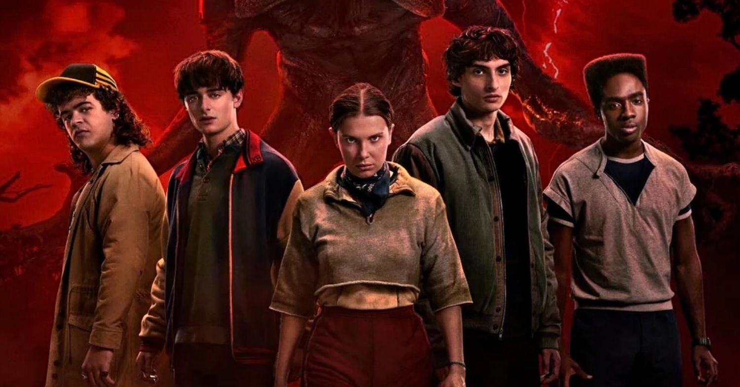 The cast of Stranger Things season 5 standing in front of a demogorgon