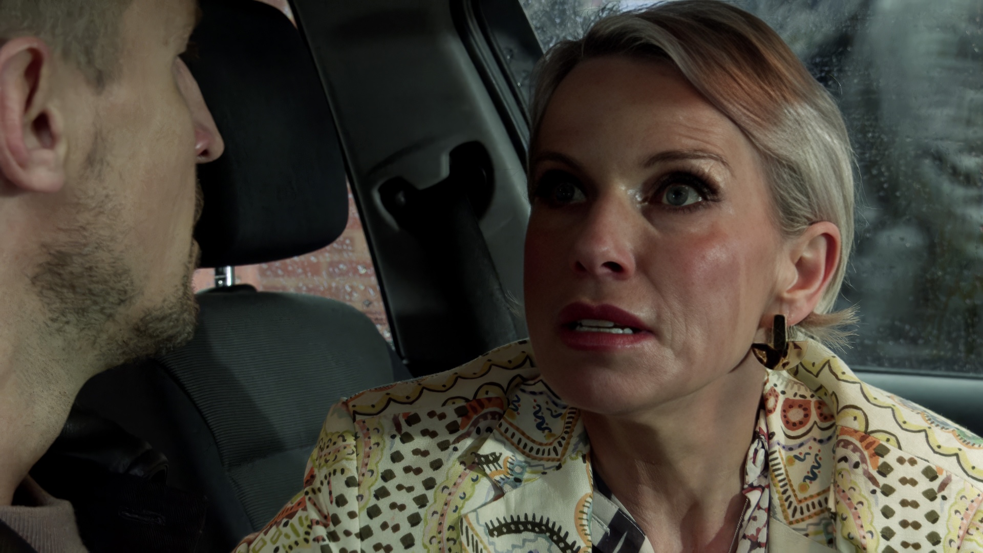 Carl talking to Debbie in the car