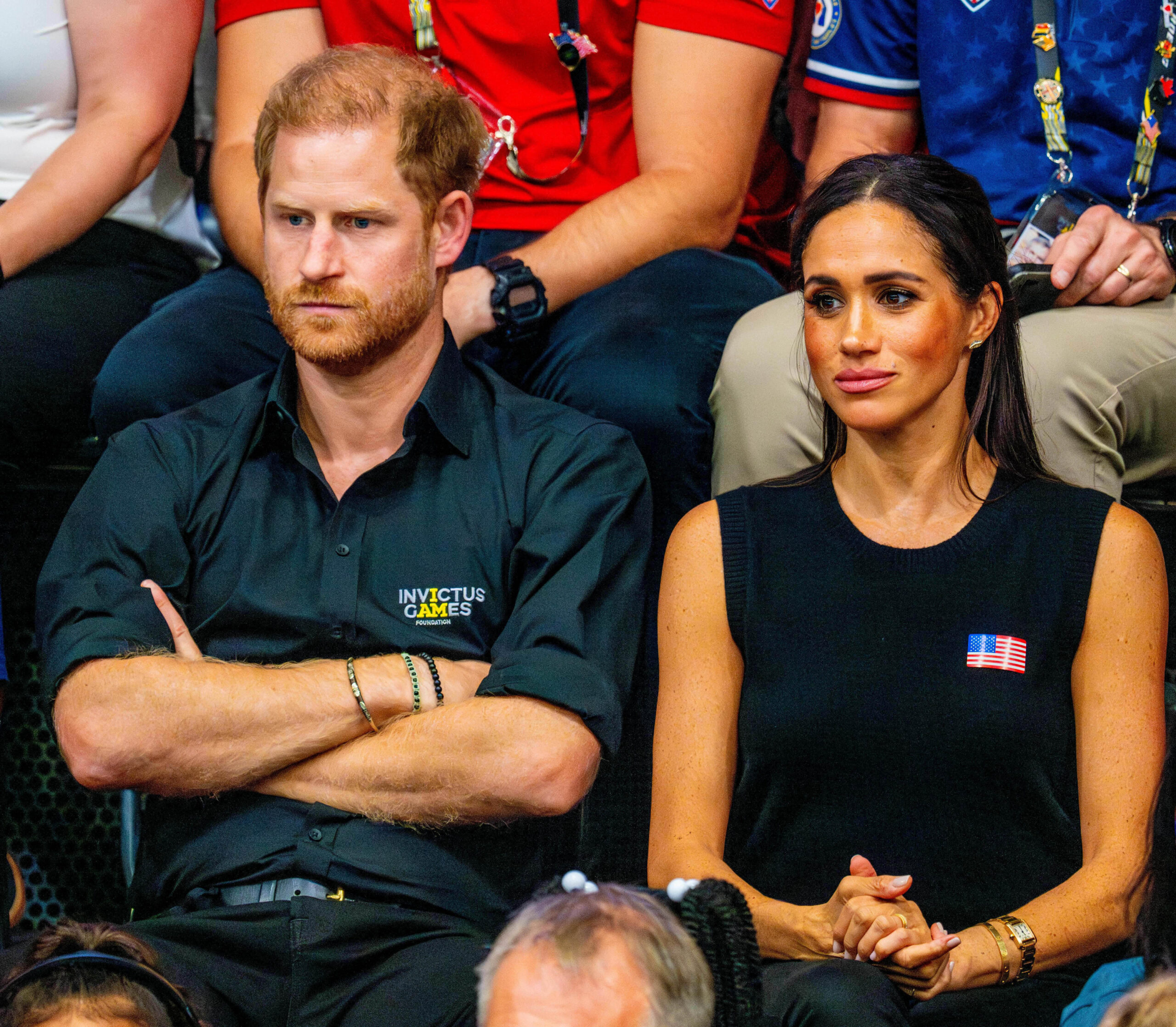 Harry and Meghan frowning