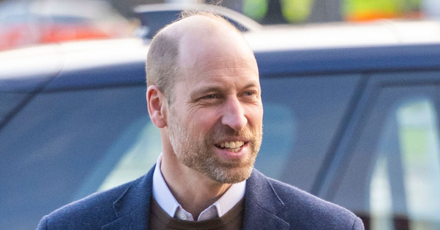 Prince William smiling in blue blazer in Scotland