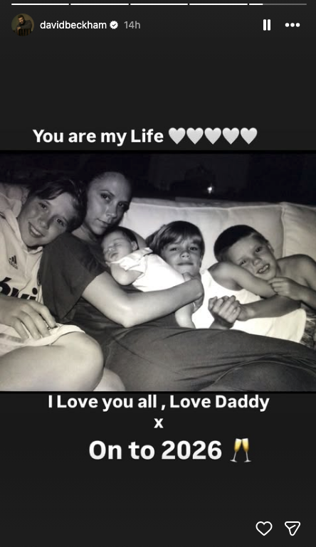 A black and white picture of Victoria Beckham with her children
