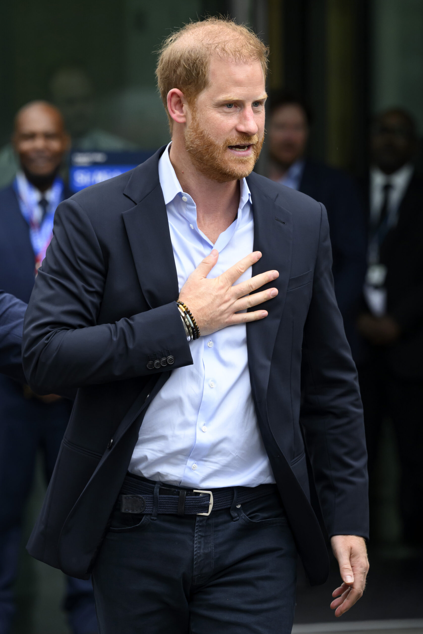 Prince Harry walking in suit