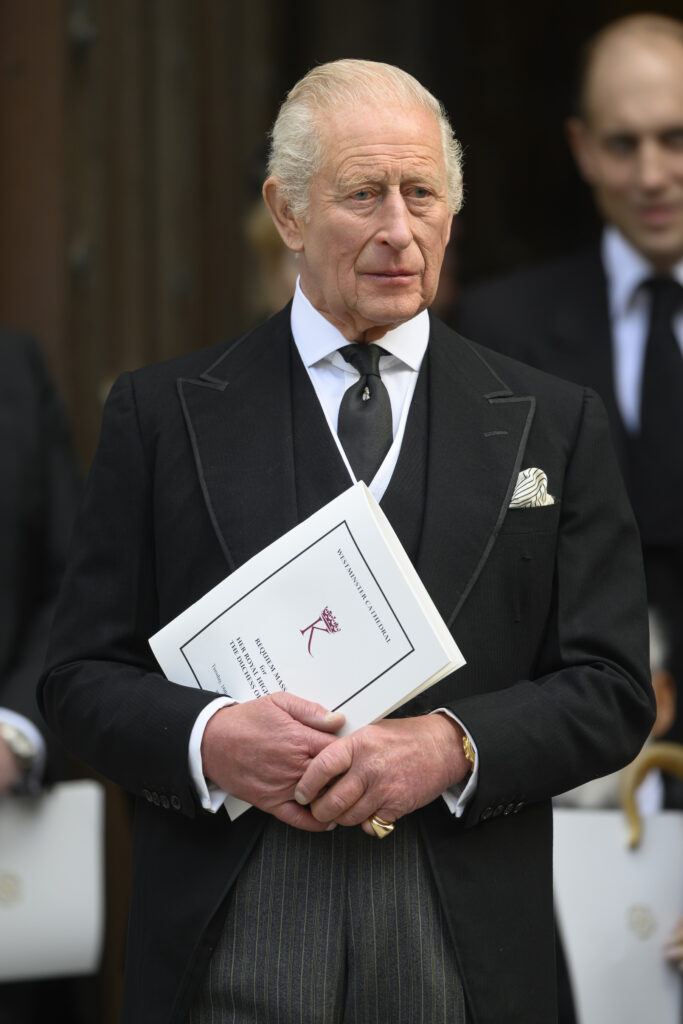 King Charles frowning at the Duchess of Kent's wedding
