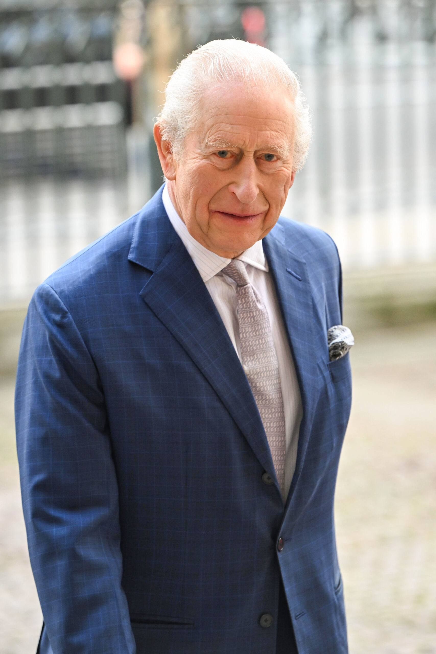 King Charles walking in suit