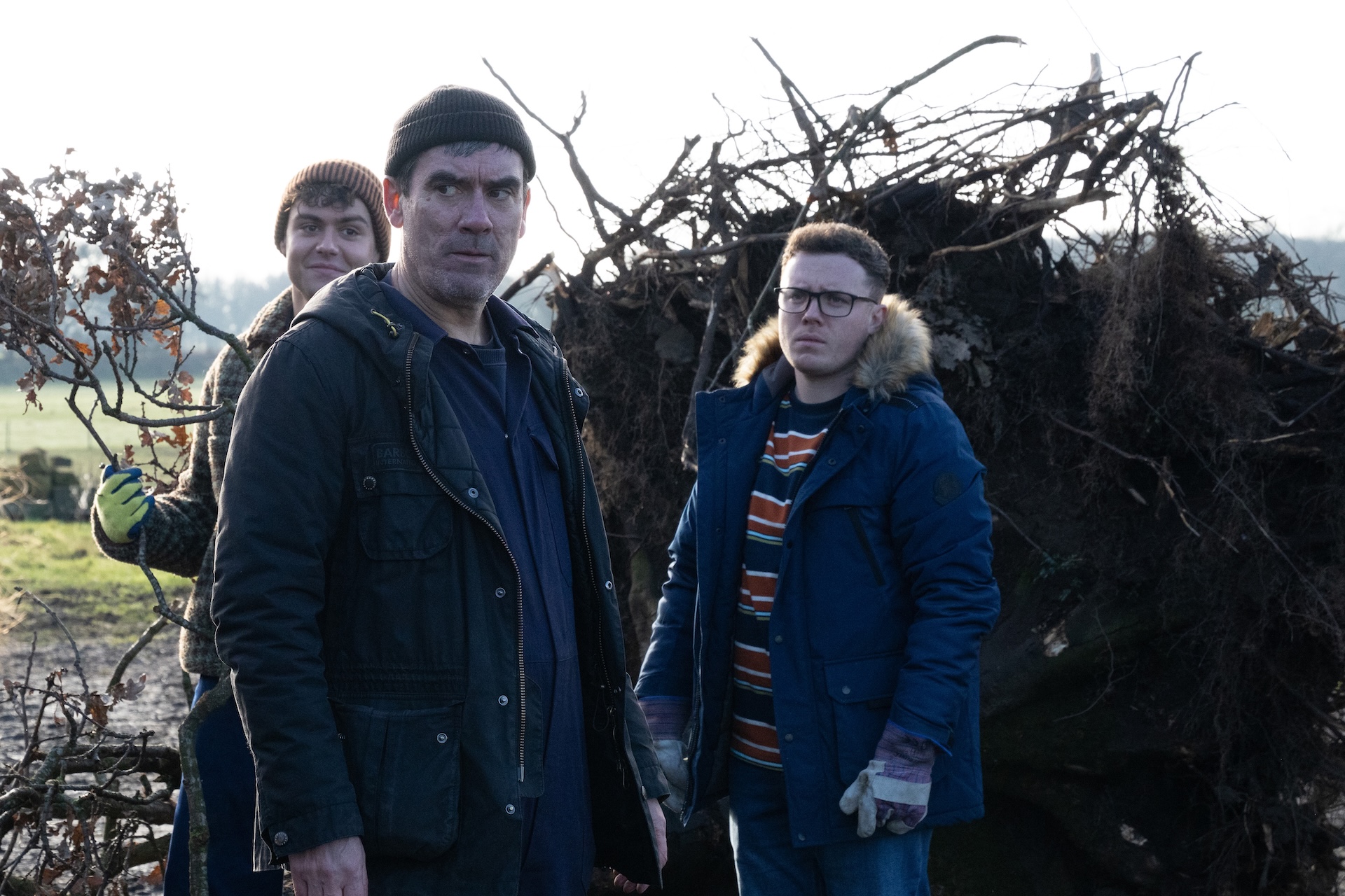 Cain looks thunderous as Lewis and Vinny watch on