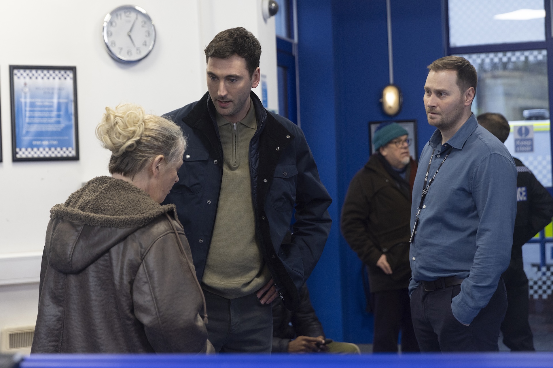 Bernie talking to Kit at police station
